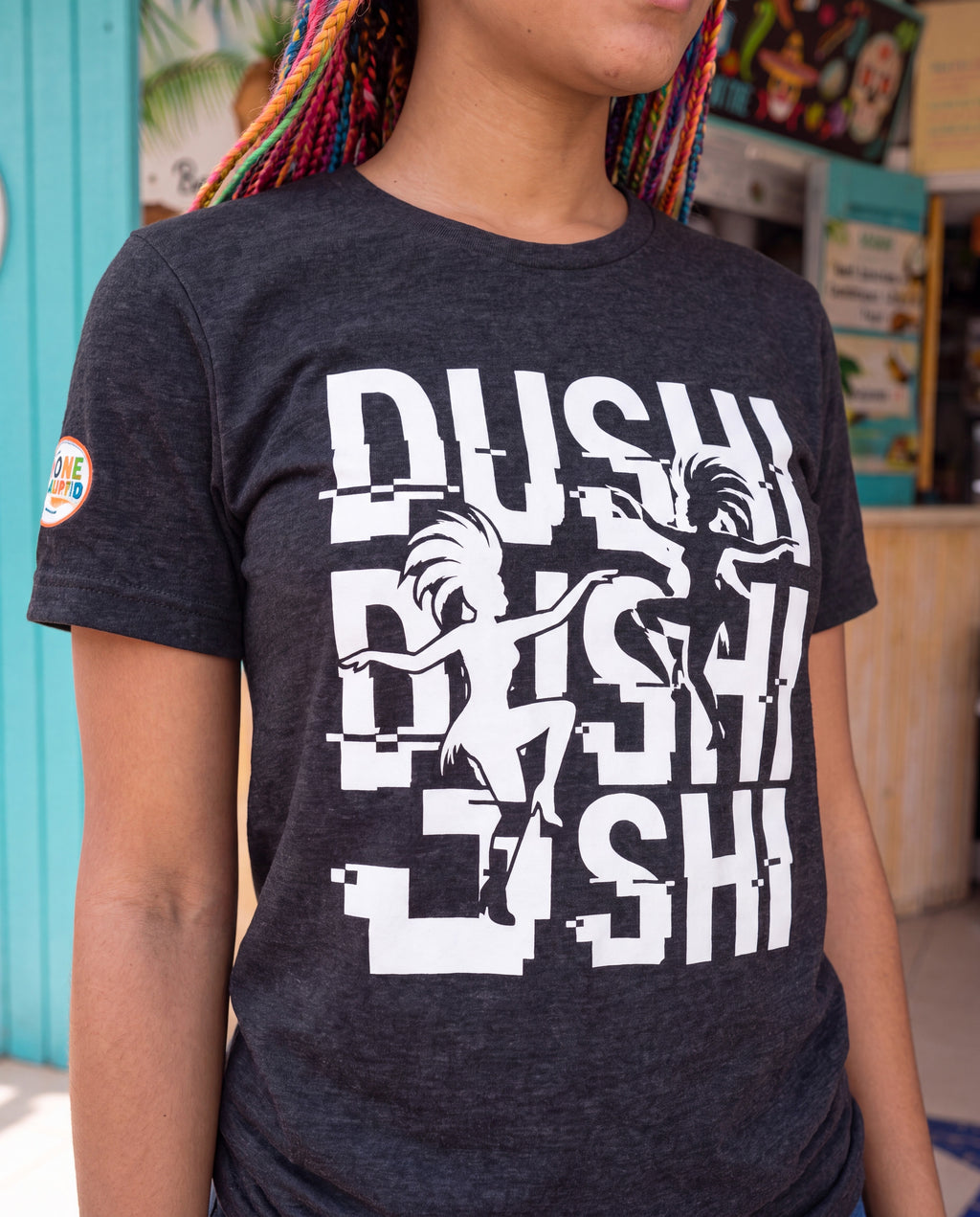 Dushi Aruba Glitch Carnival Tee close-up of the design