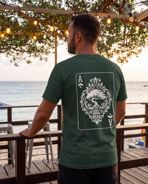 Aruba Ace of Spades Tee in Forest, worn on location in Aruba