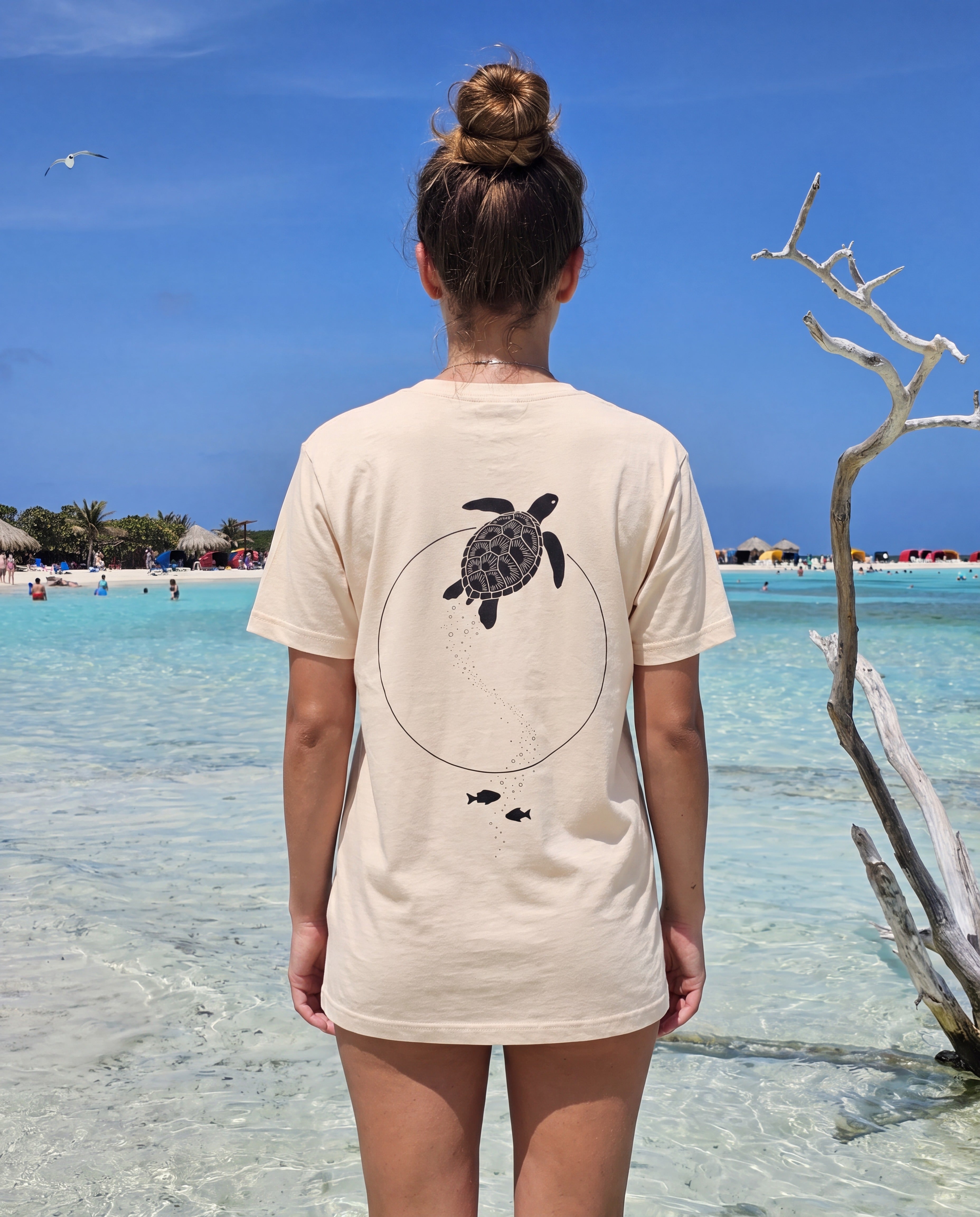 Moon Gate Sea Turtle Tee in Soft Cream, worn on location in Aruba