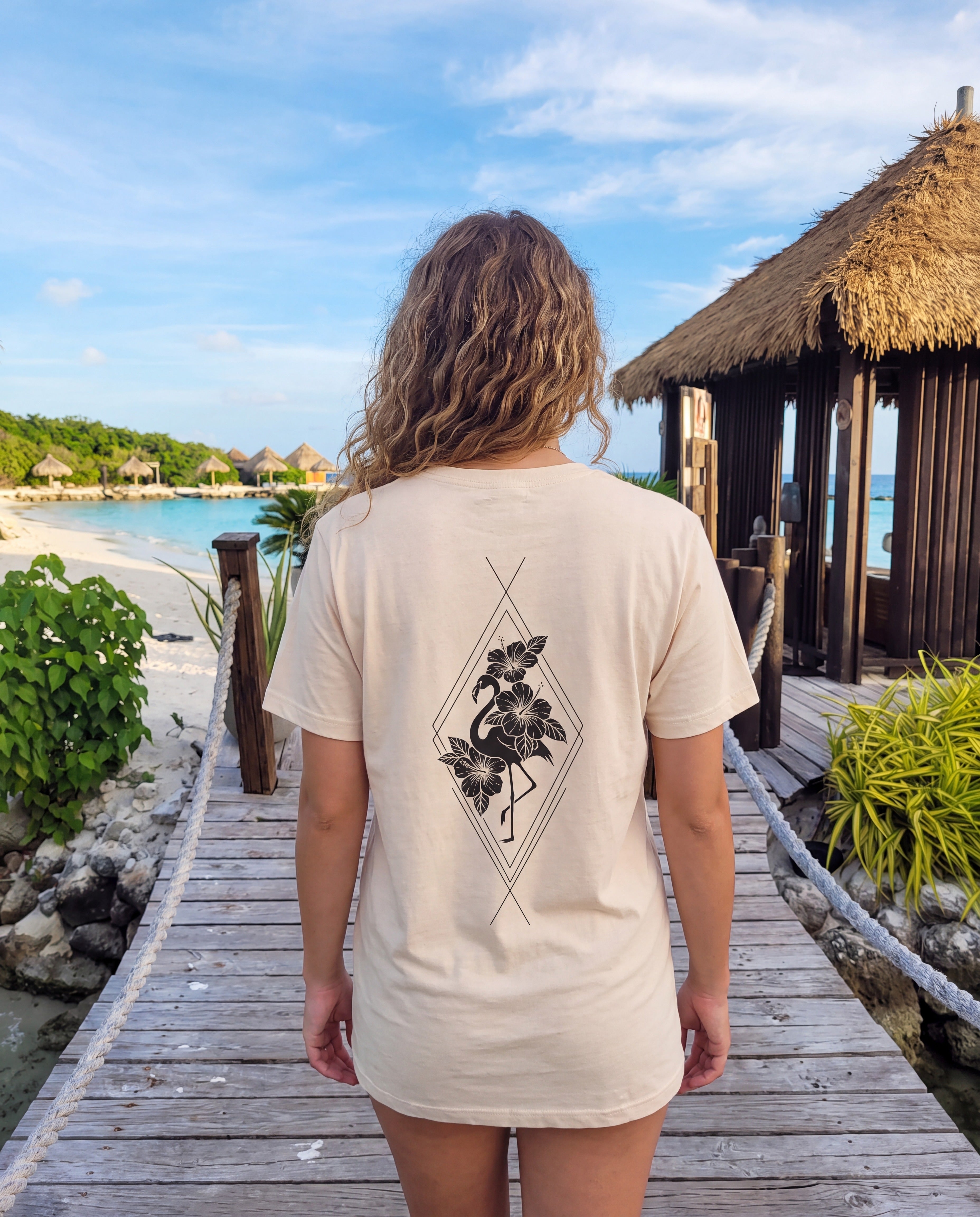 Flamingo & Hibiscus Diamond Tee in Soft Cream, worn on location in Aruba