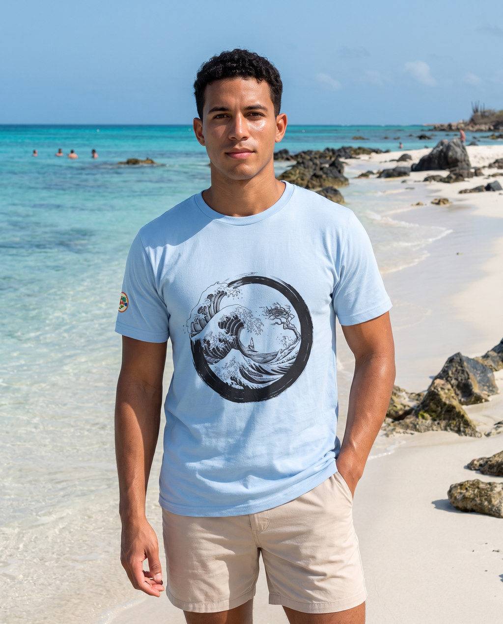 Aruba Great Wave Enso Tee in Baby Blue, worn on Boca Catalina beach, Aruba