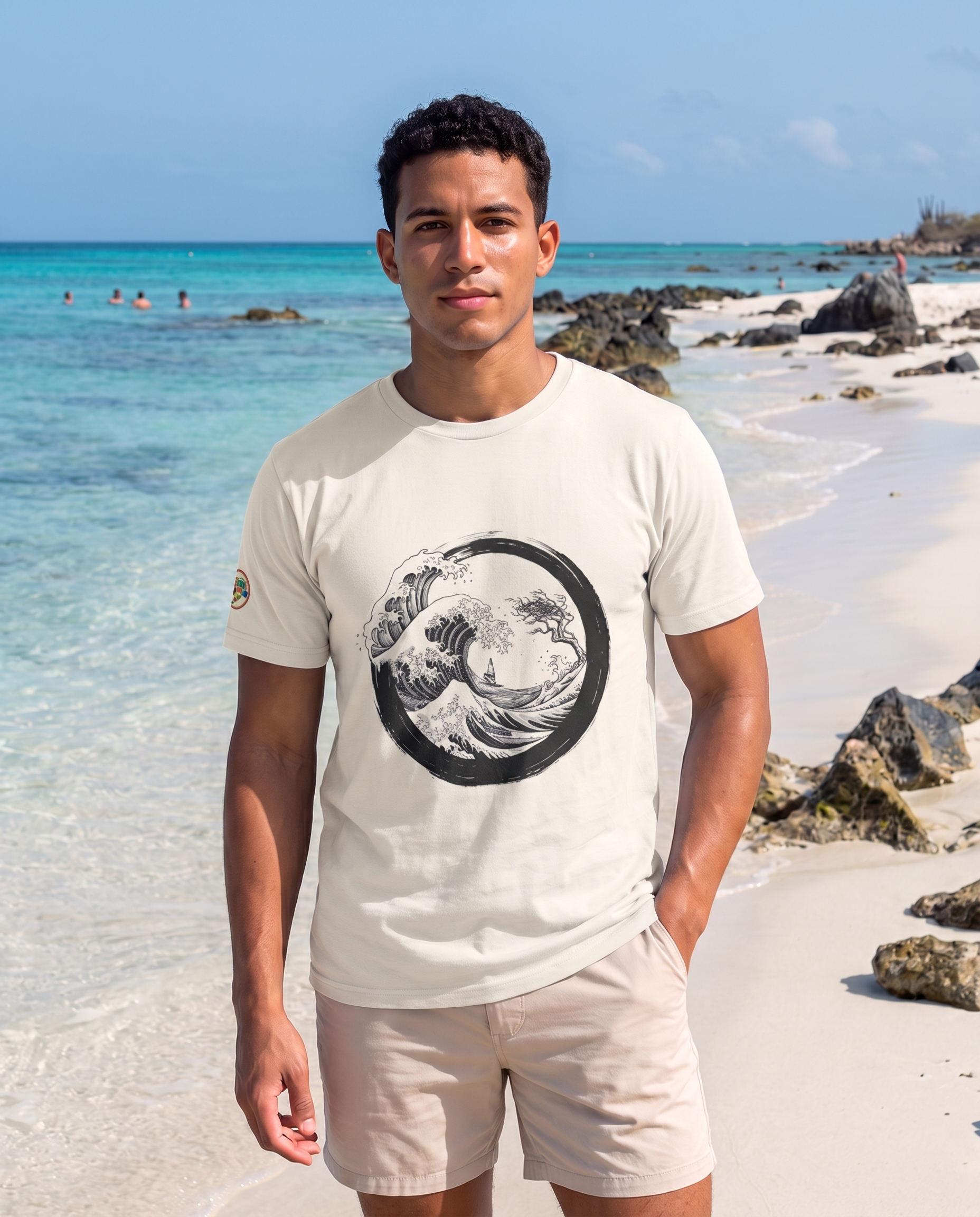 Aruba Great Wave Enso Tee in Natural, worn on Boca Catalina beach, Aruba