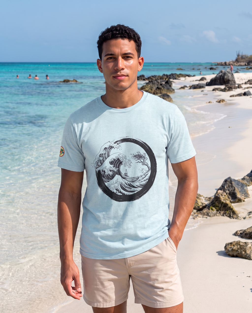 Aruba Great Wave Enso Tee in Heather Prism Ice Blue, worn on Boca Catalina beach, Aruba