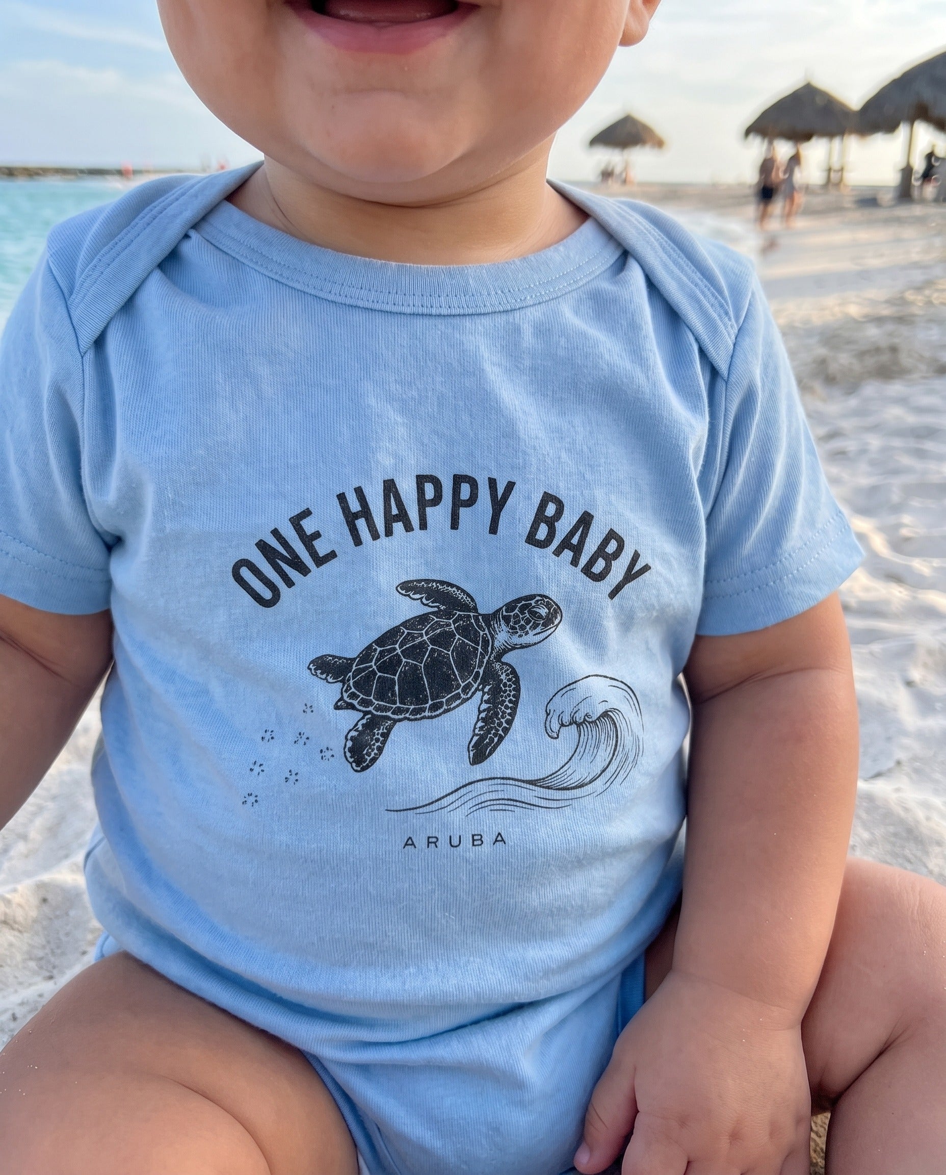 Aruba One Happy Baby Turtle Tee close-up of the design, Light Blue