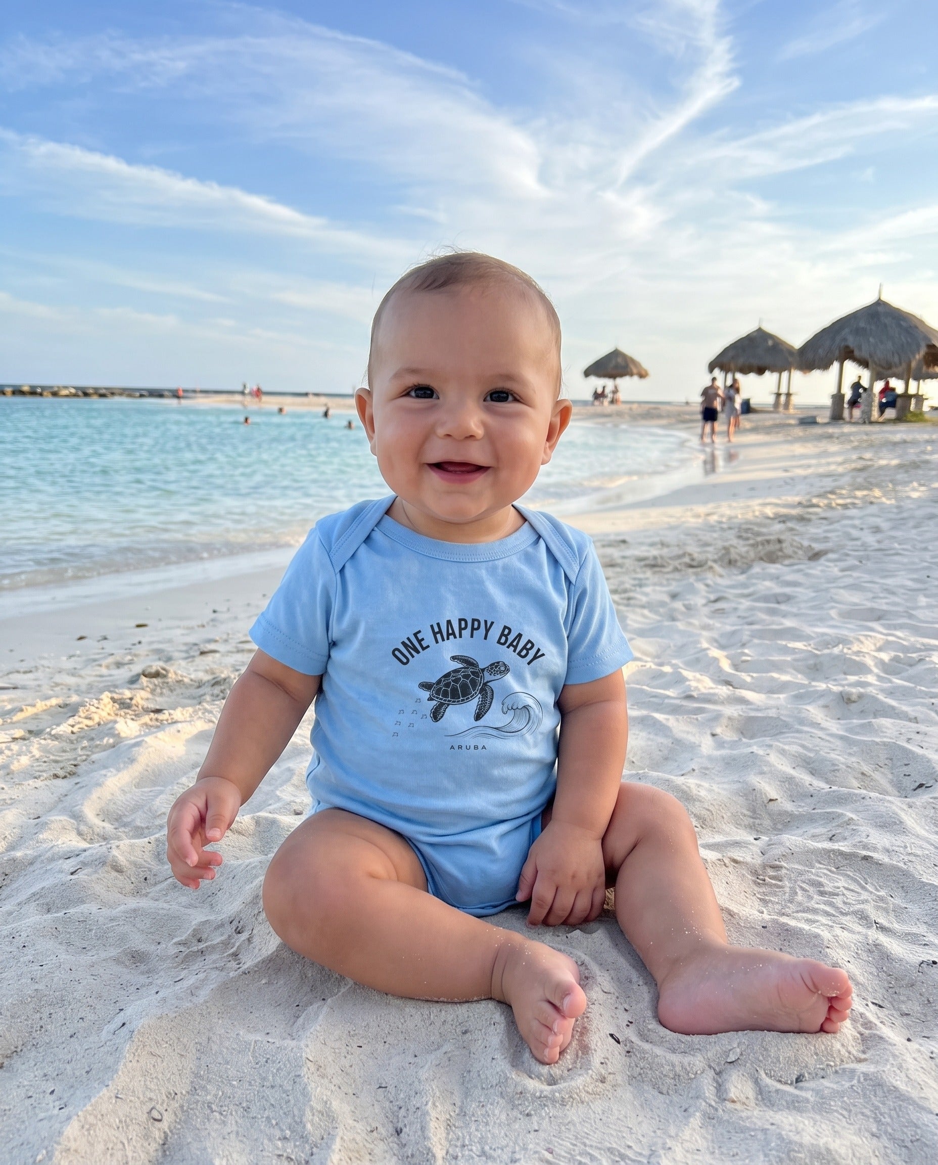 Aruba One Happy Baby Turtle Tee in Light Blue, worn on location in Aruba