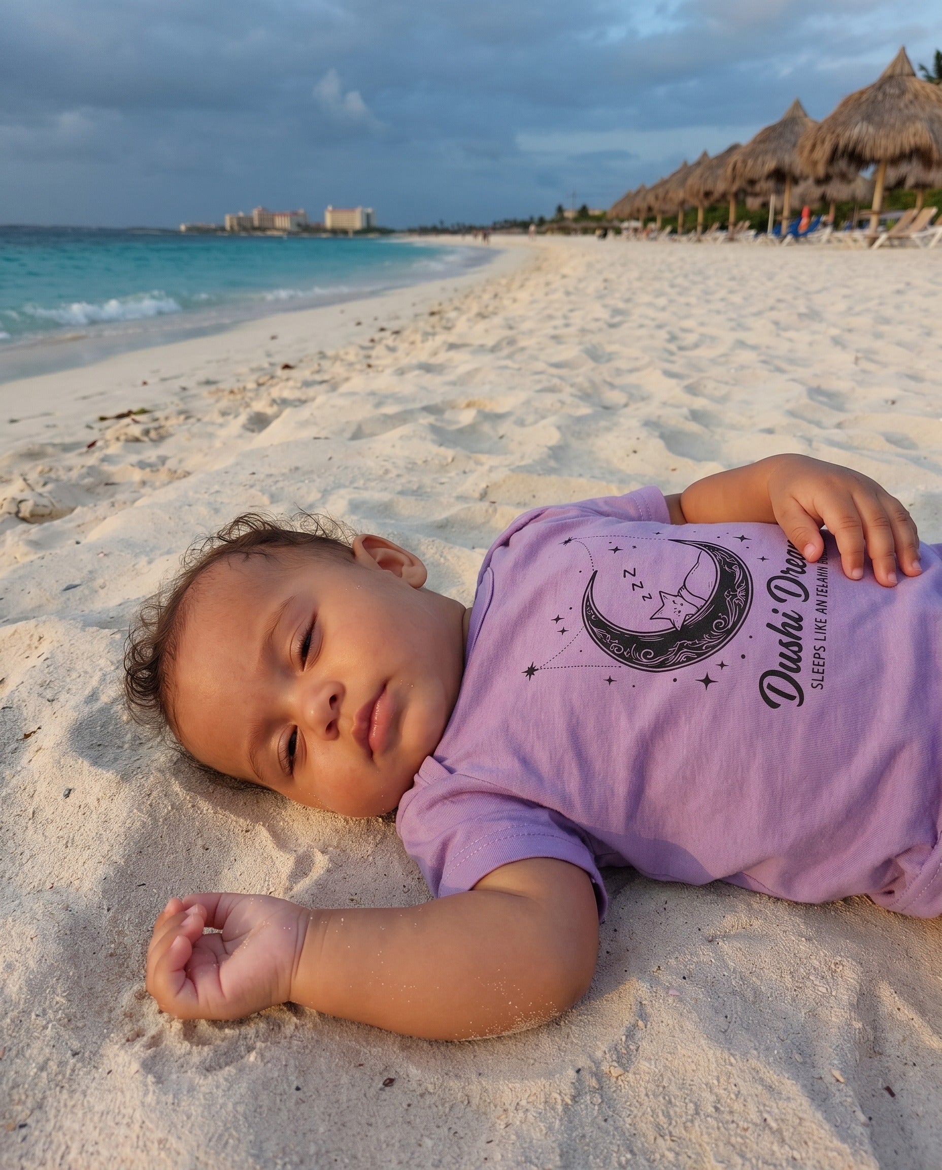 Aruba Dushi Dreams Moon Baby Tee in Lavender, worn on location in Aruba
