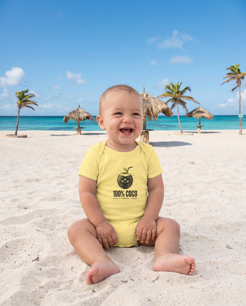 Aruba 100% Coco Coconut Bodysuit in Butter, worn on location in Aruba