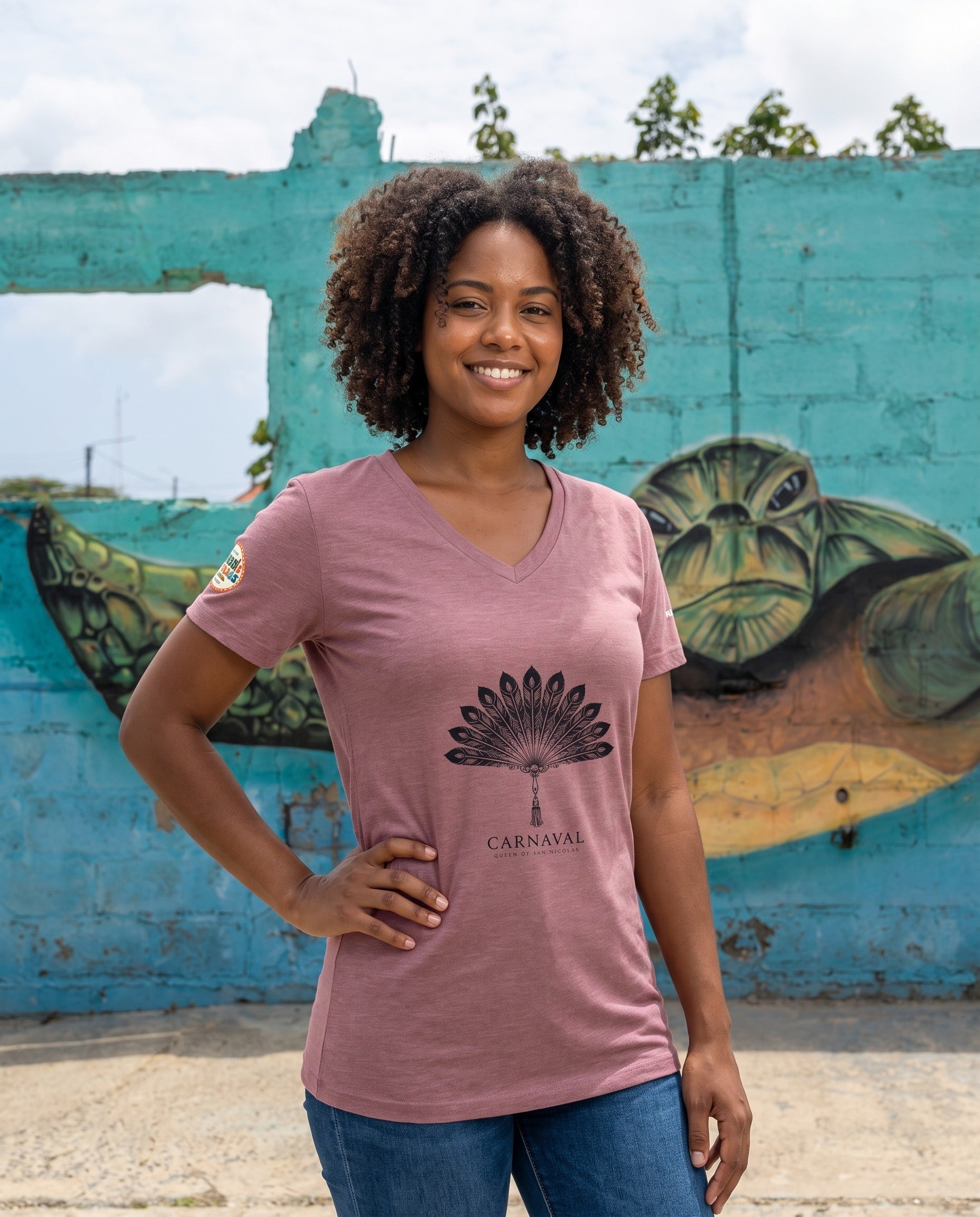 Aruba Carnaval Feather Fan V-Neck Tee in Heather Mauve, worn on location in Aruba