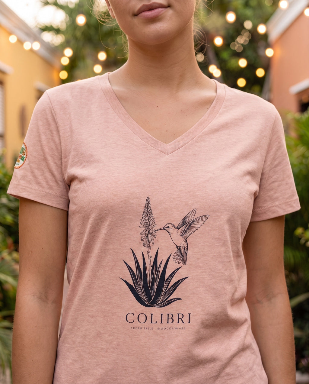 Aruba Colibri Hummingbird V-Neck Tee close-up of the design, Heather Peach