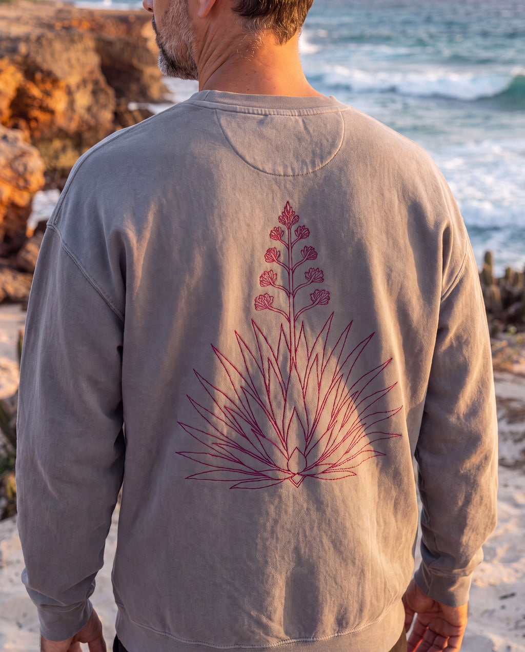 Aruba Agave Crest Redwork Sweatshirt close-up of the design, Grey