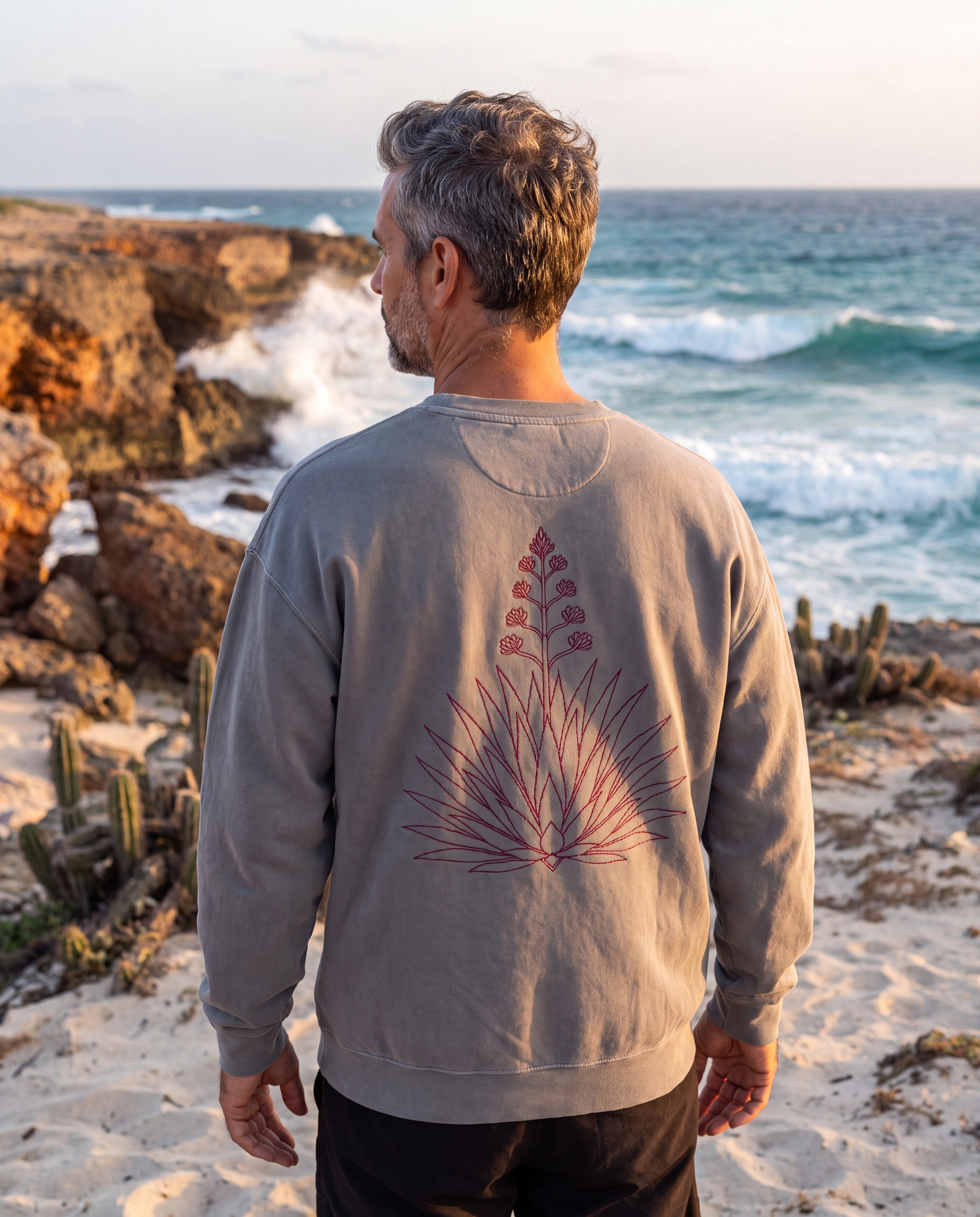 Aruba Agave Crest Redwork Sweatshirt in Grey, worn on location in Aruba