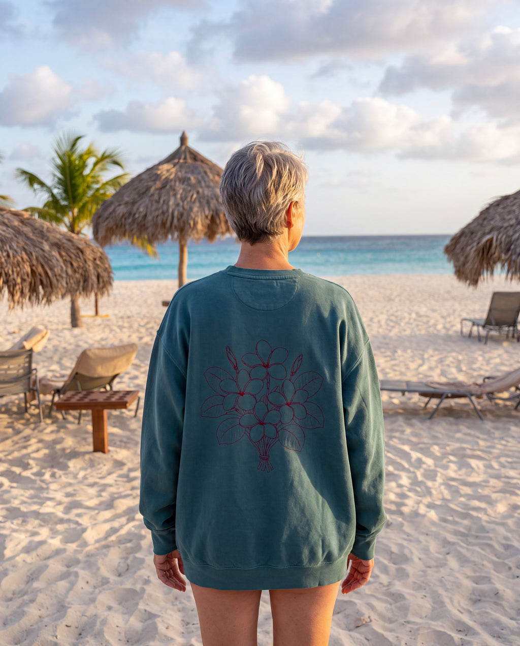 Aruba Frangipani Posy Redwork Sweatshirt in Blue Spruce, worn on location in Aruba