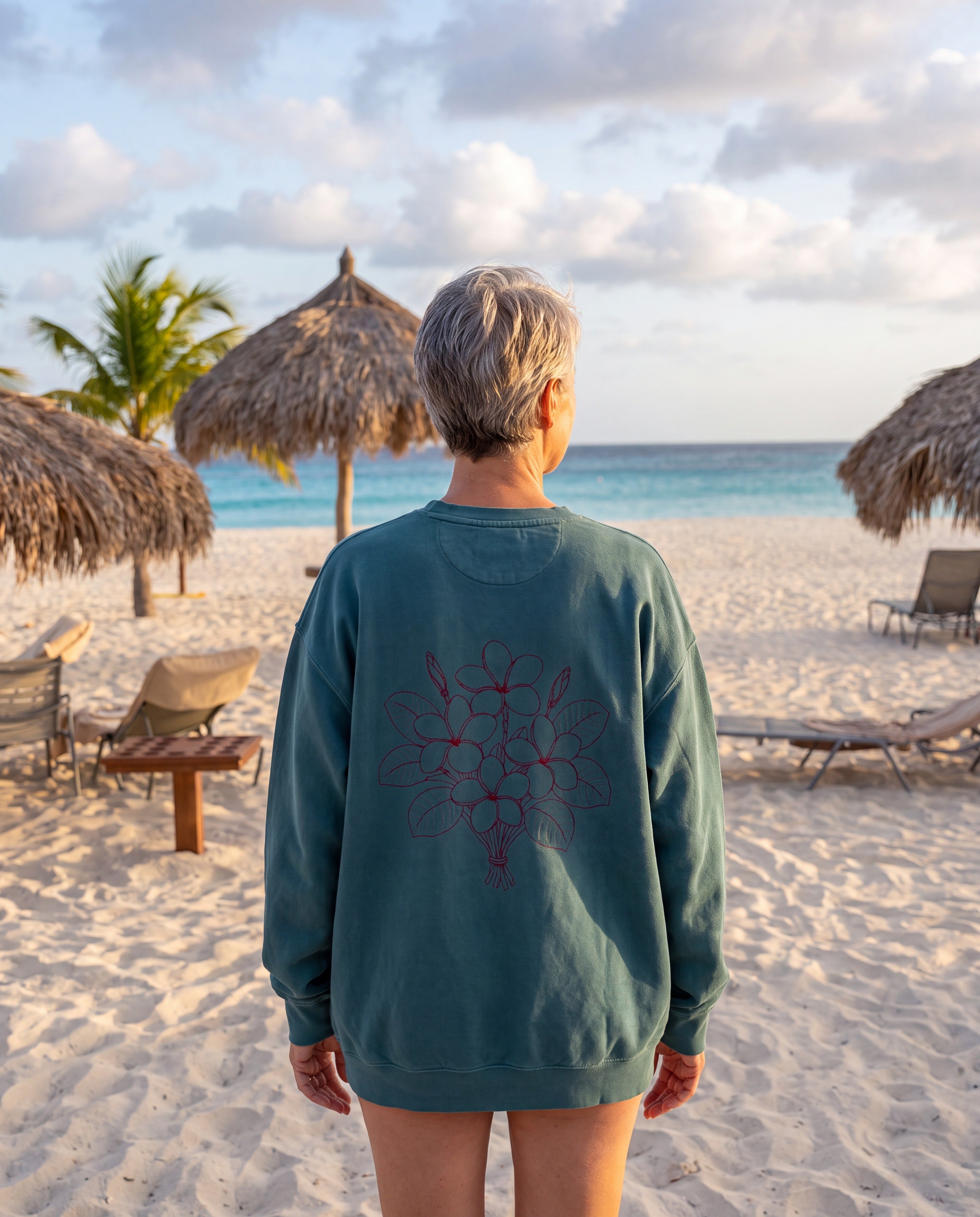 Aruba Frangipani Posy Redwork Sweatshirt in Blue Spruce, worn on location in Aruba