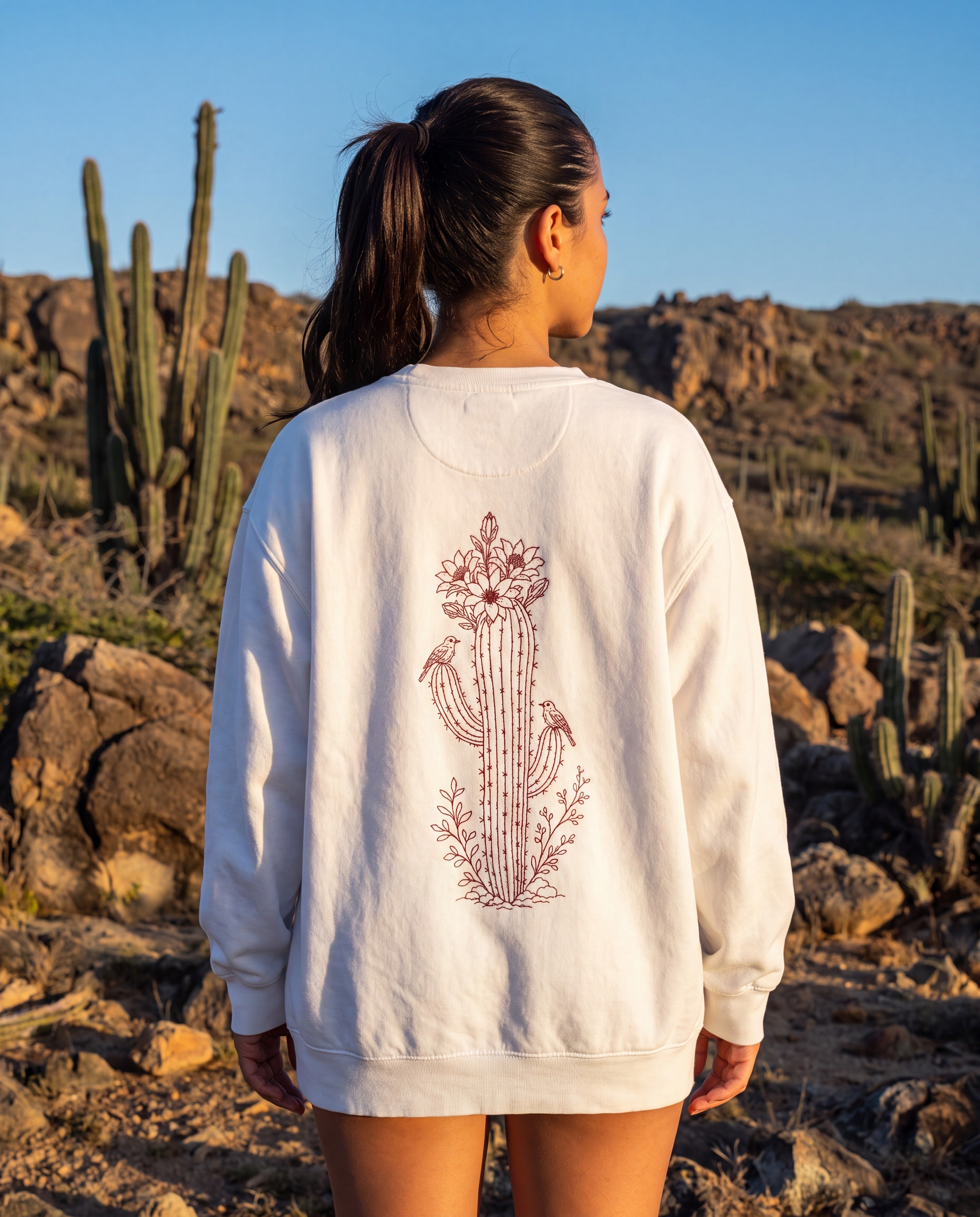 Aruba Cadushi Cactus Redwork Sweatshirt in White, worn on location in Aruba