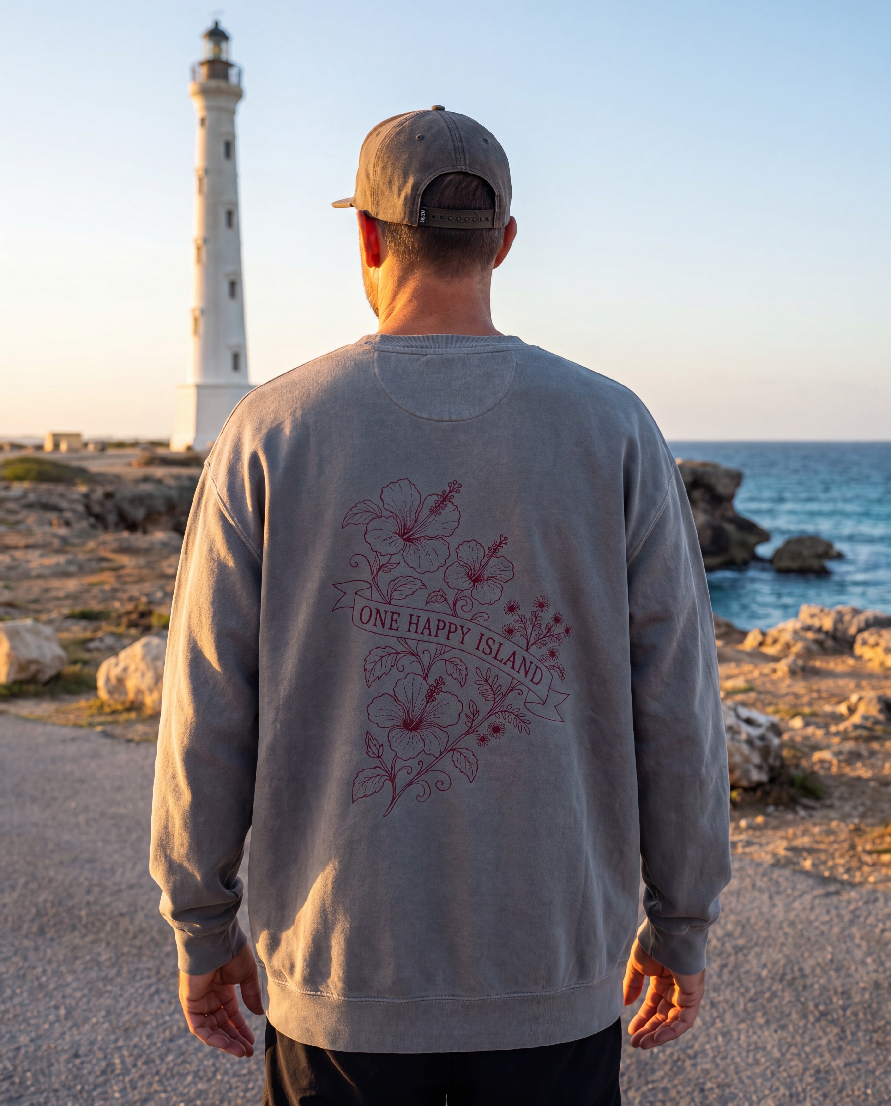 Aruba One Happy Island Banner Redwork Sweatshirt in Grey, worn on location in Aruba
