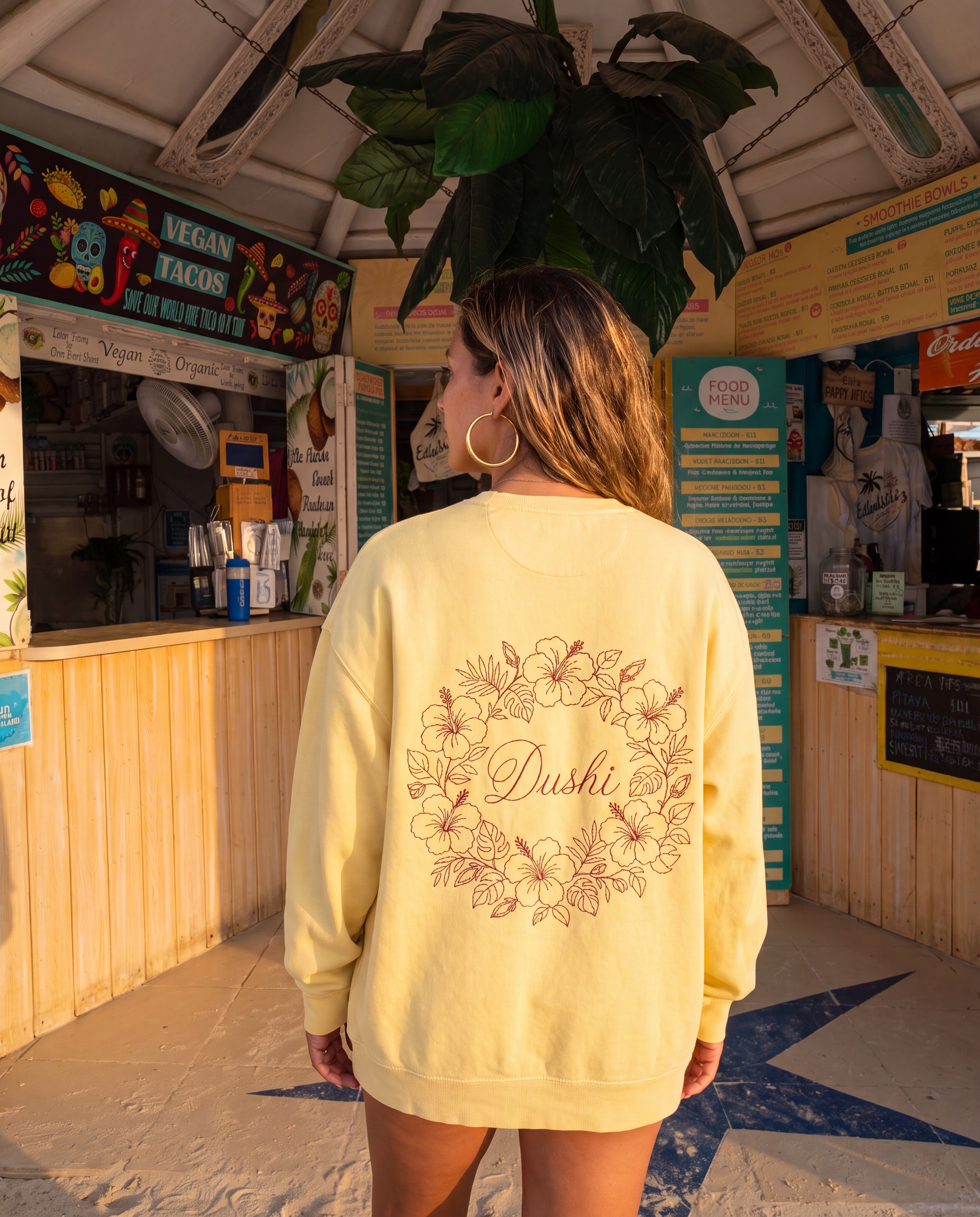Aruba Dushi Wreath Redwork Sweatshirt in Butter, worn on location in Aruba