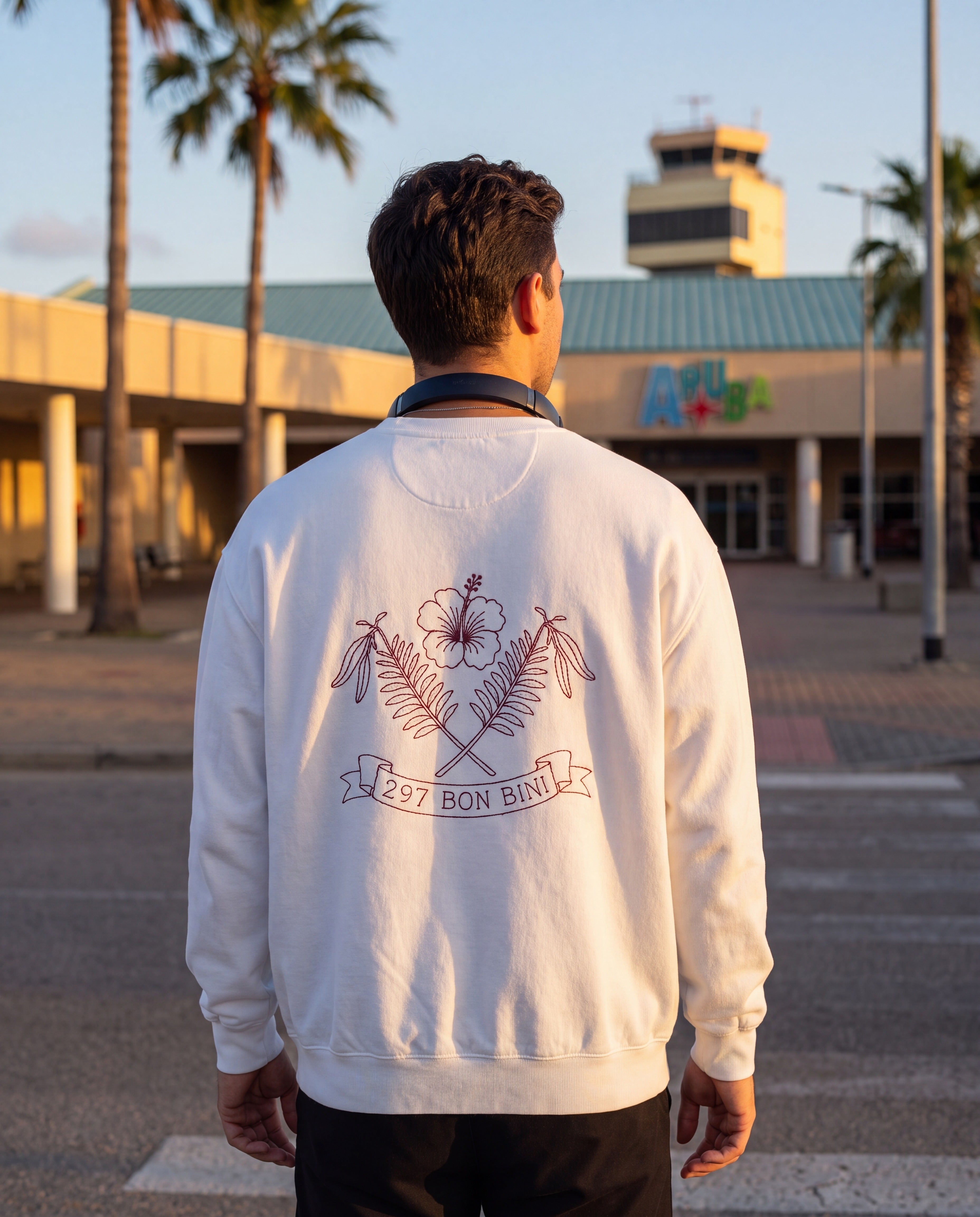 Aruba 297 Bon Bini Crest Redwork Sweatshirt in White, worn on location in Aruba