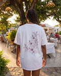 Aruba Hibiscus Spray Redwork Tee in White, worn on location in Aruba