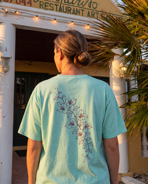 Aruba Bougainvillea Cascade Redwork Tee in Chalky Mint, worn on location in Aruba