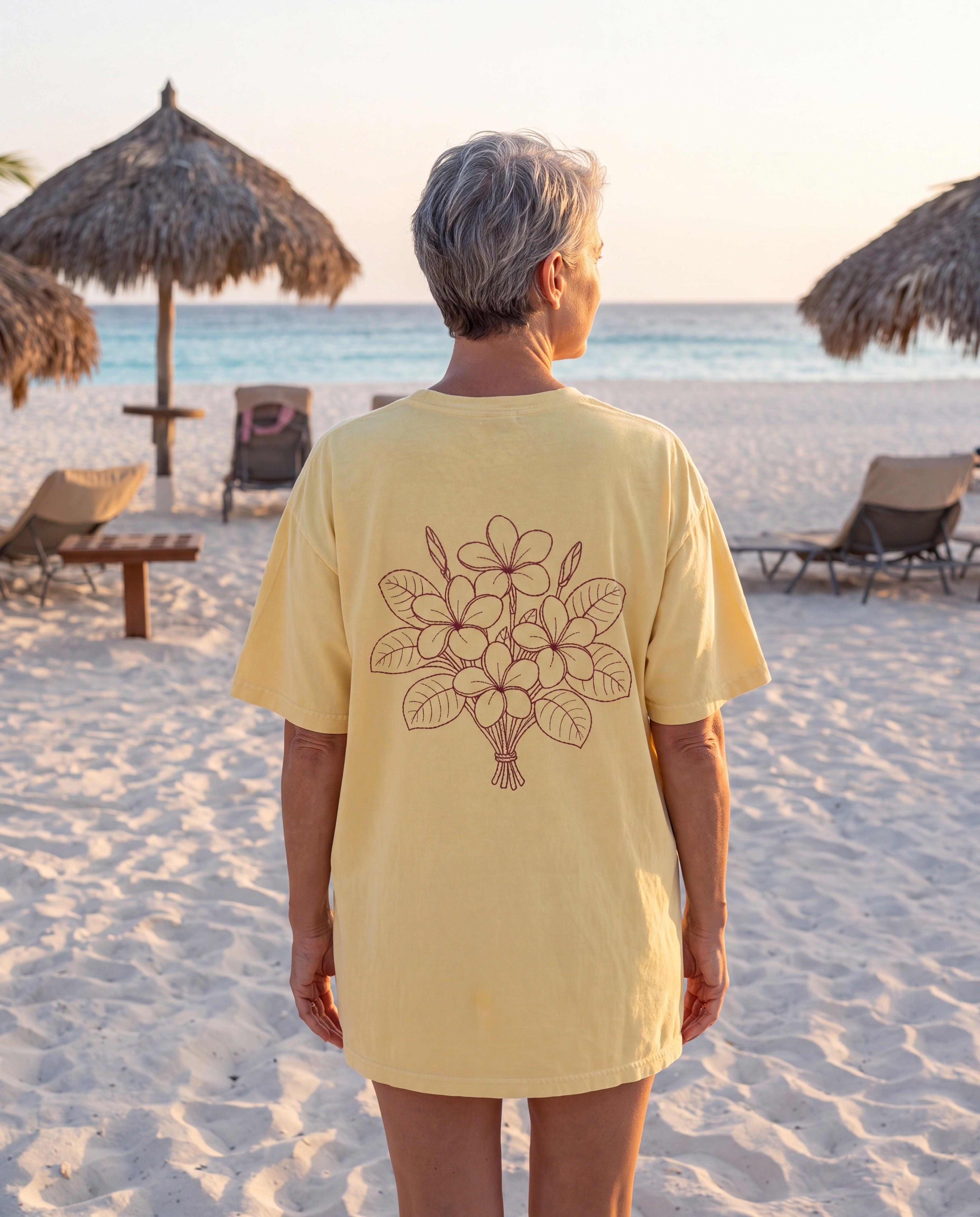 Aruba Frangipani Posy Redwork Tee in Butter, worn on location in Aruba