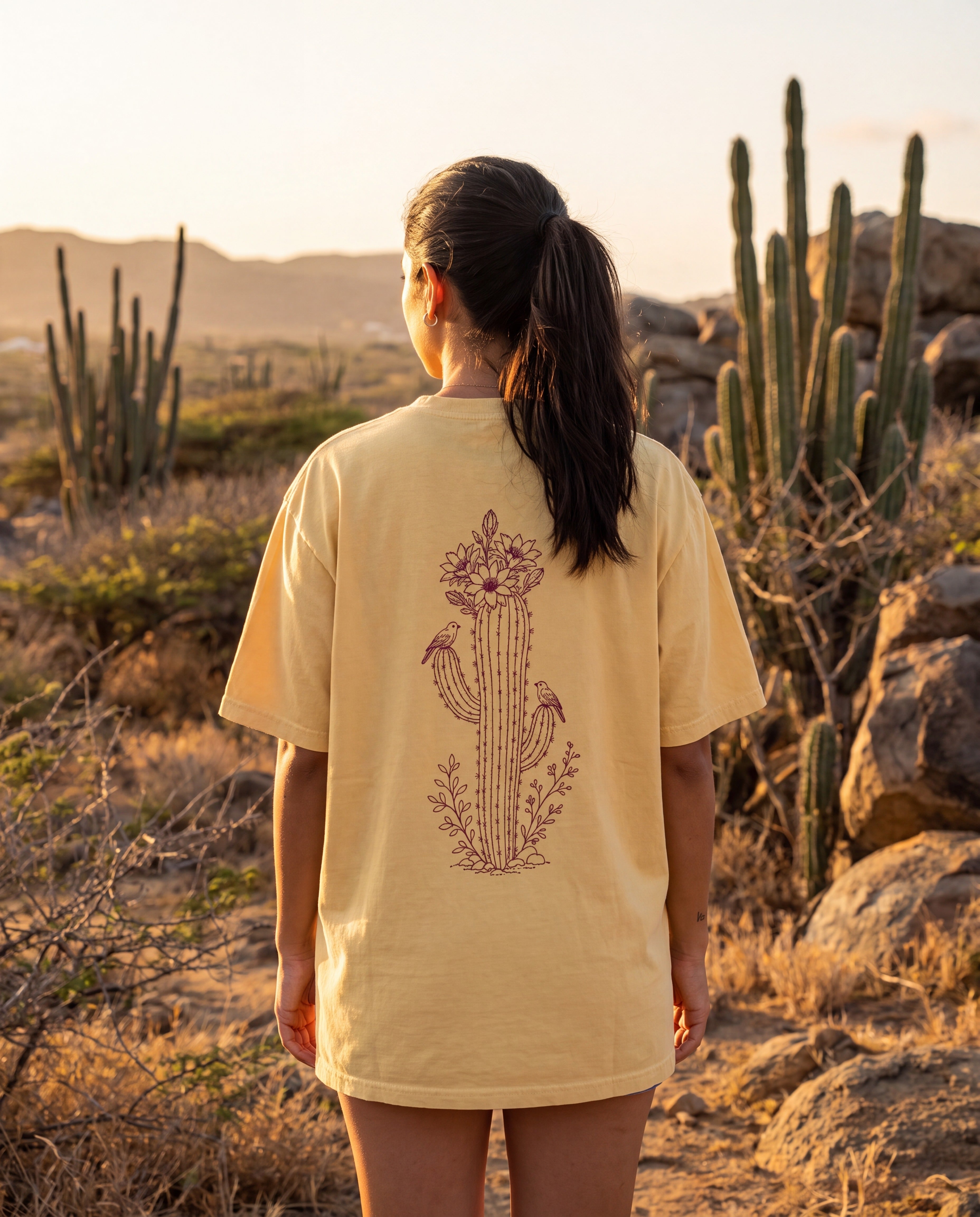 Aruba Cadushi Cactus Redwork Tee in Butter, worn on location in Aruba