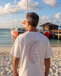 Aruba Coconut Palm Sprig Redwork Tee in White, worn on location in Aruba