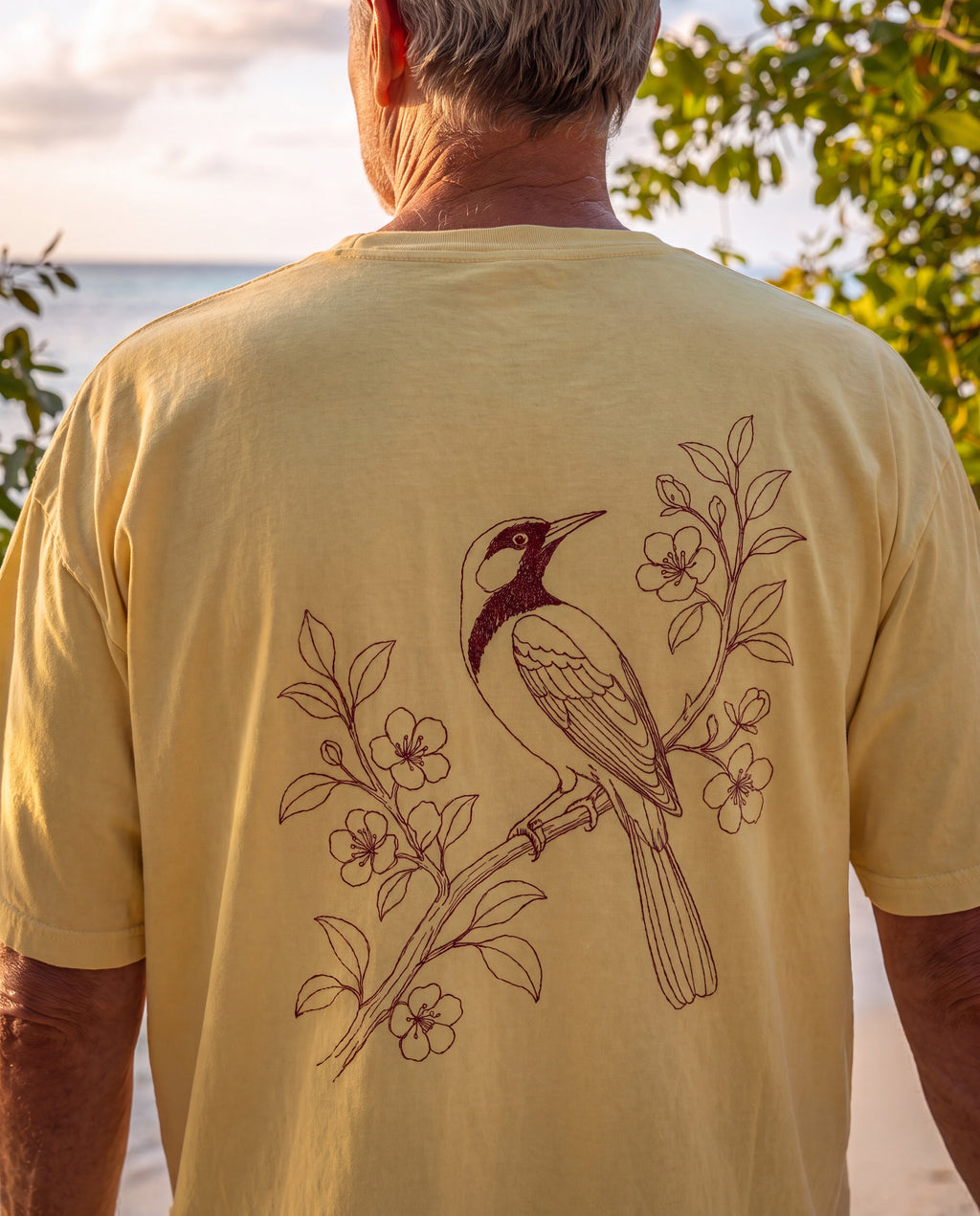 Aruba Trupial on Branch Redwork Tee close-up of the design, Butter
