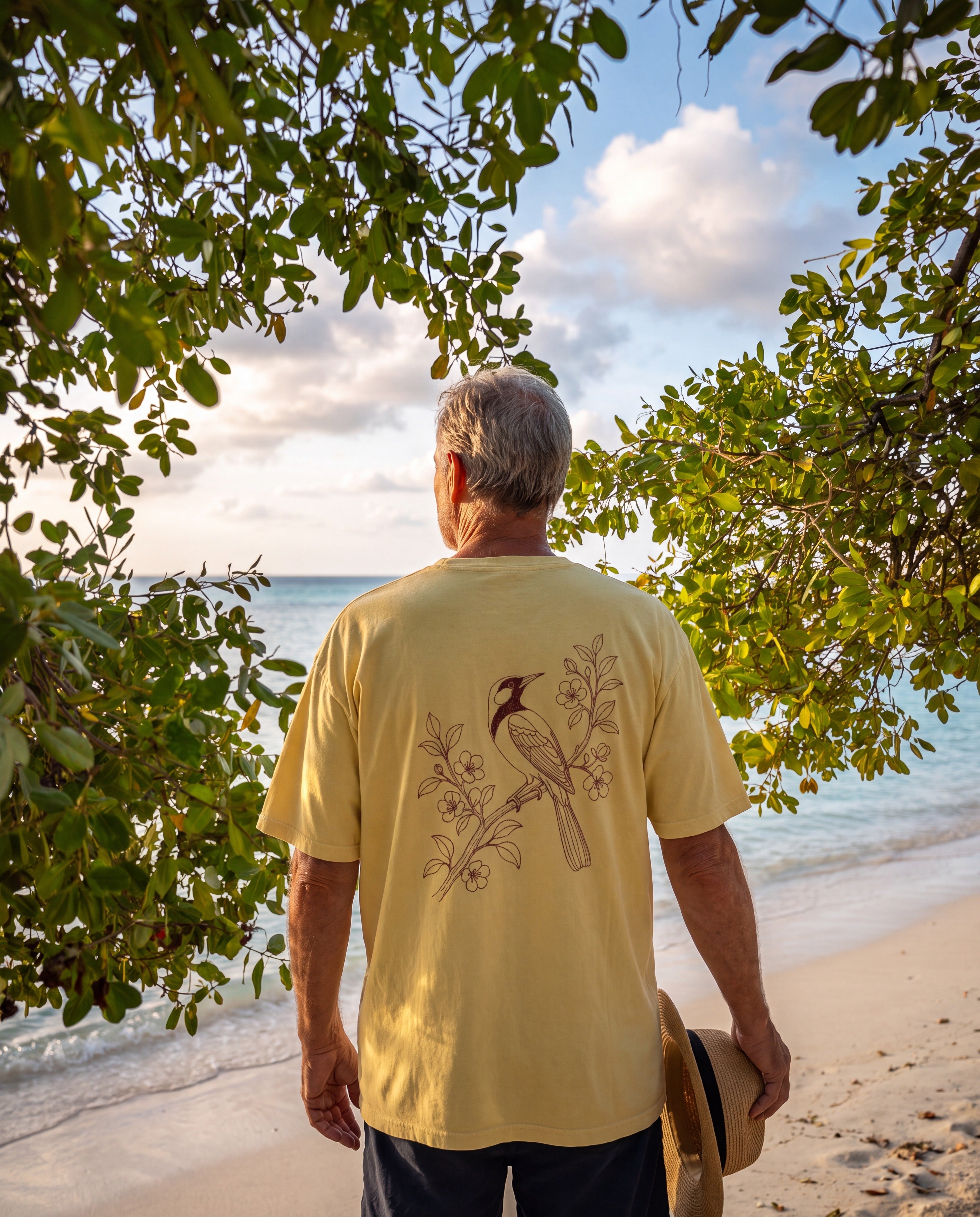 Aruba Trupial on Branch Redwork Tee in Butter, worn on location in Aruba