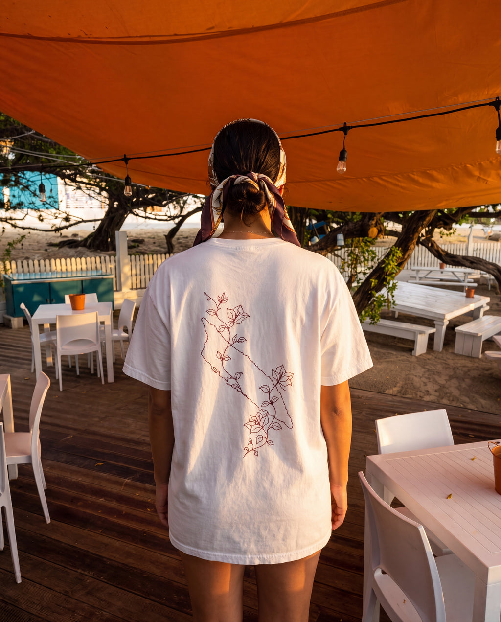 Aruba Island Vine Redwork Tee in White, worn on location in Aruba