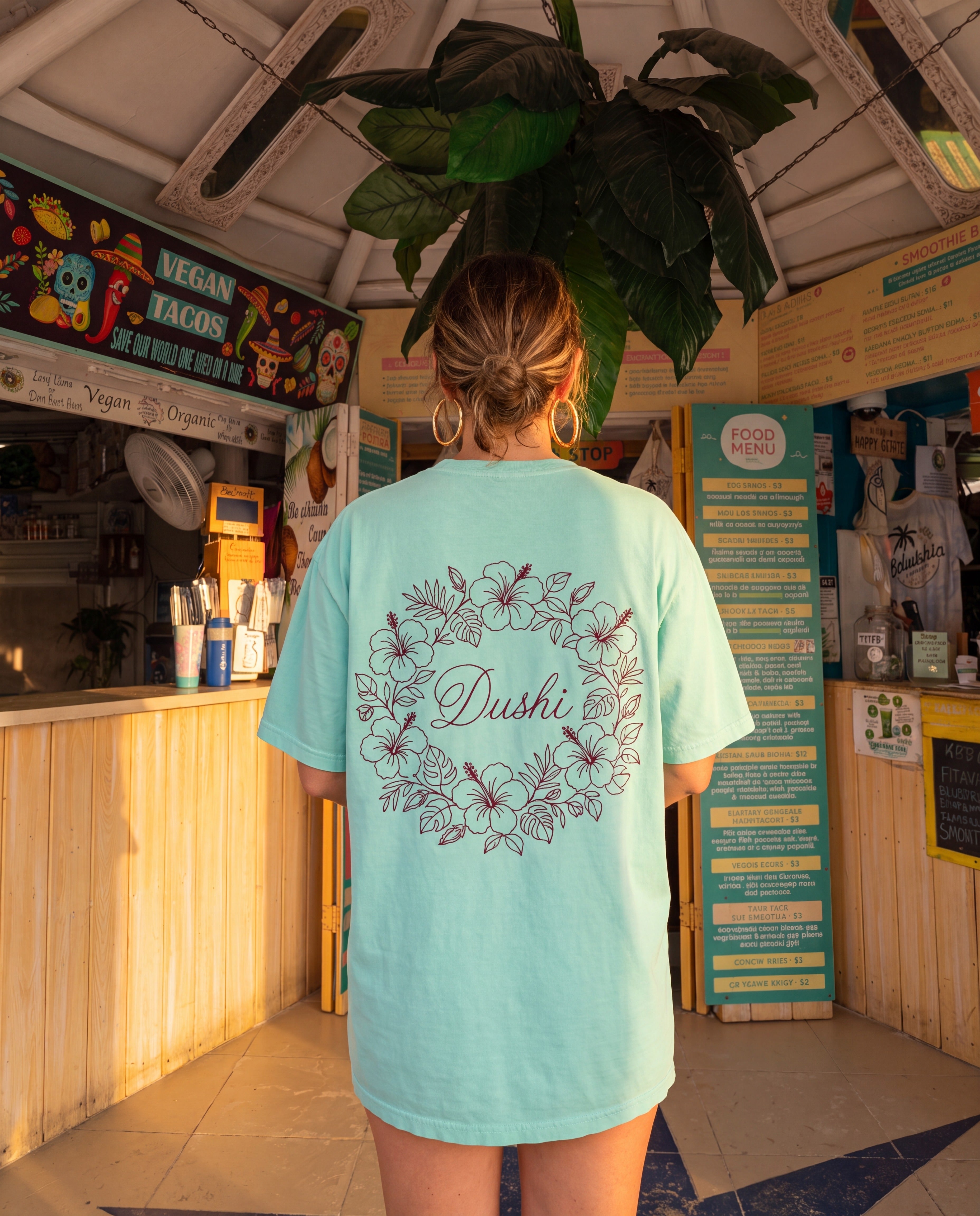 Aruba Dushi Wreath Redwork Tee in Chalky Mint, worn on location in Aruba