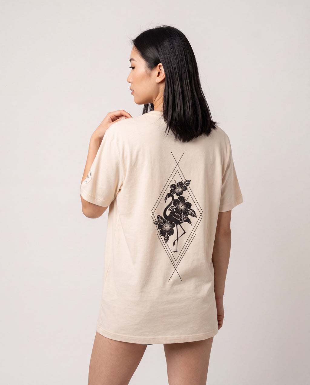 Model wearing the Aruba Flamingo & Hibiscus Tee